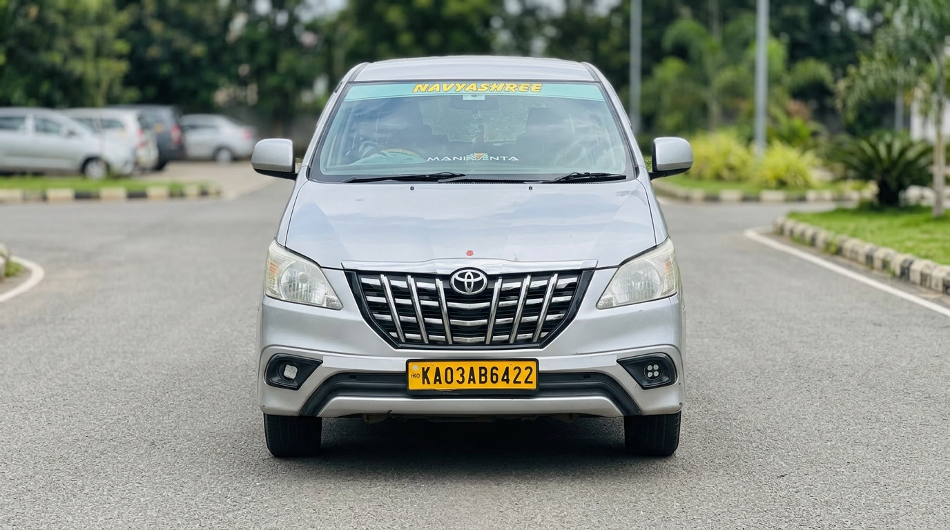 Silver Toyota Innova SUV of Navyashree Travels, front view